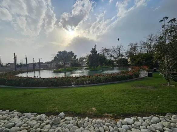 Lagoon and landscaped lawn in Villette SODIC - لاجون ومساحات خضراء في فيليت سوديك - lagoon Villette compound