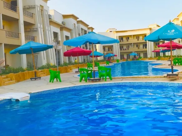 Pool area in Red Carpet resort, Ain Sokhna - حمام سباحة قرية ريد كاربت العين السخنة - chalet for sale Red Carpet Ain Sokhna pool view