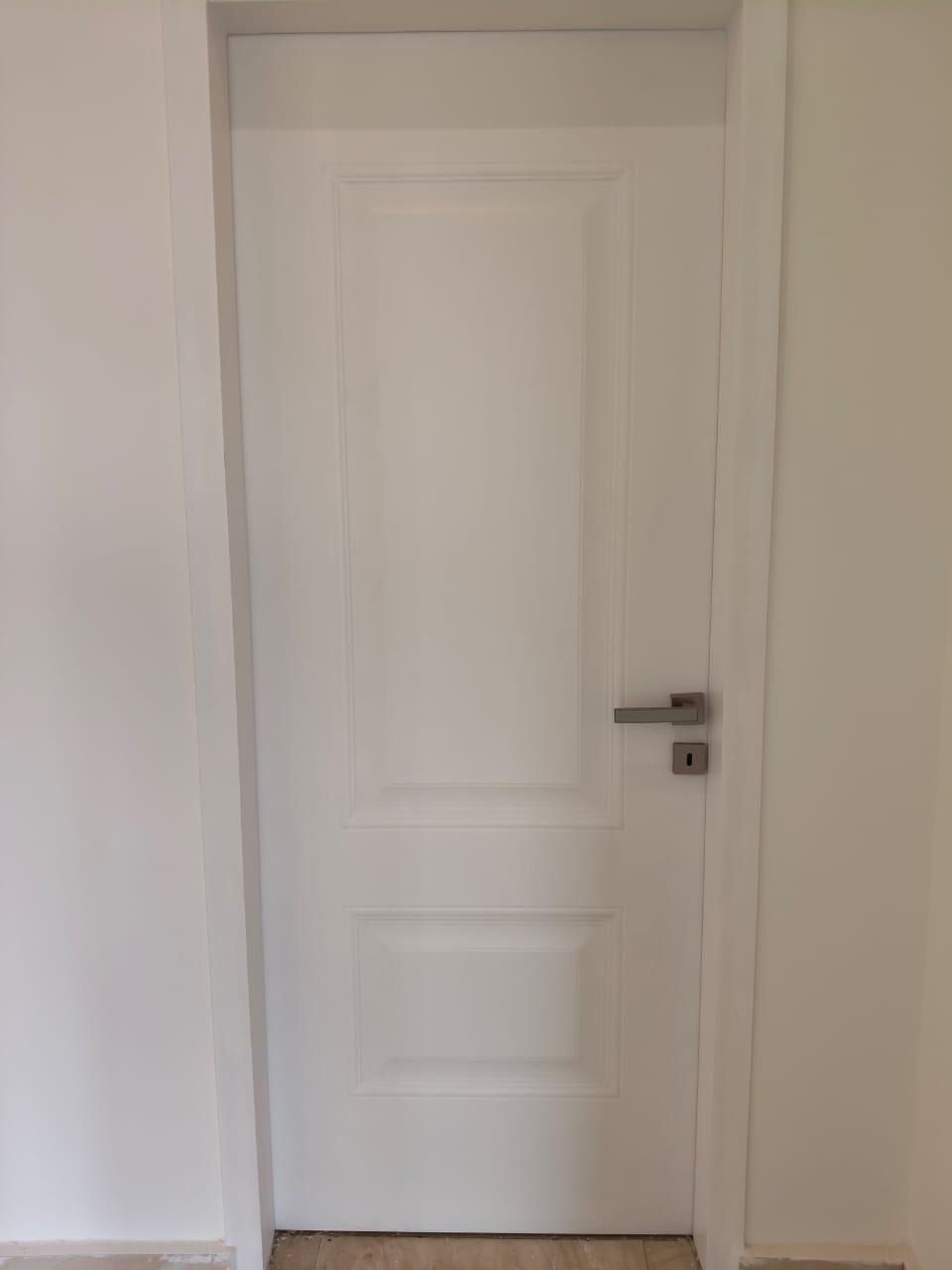 property-image-69ebfd23a3daf White panelled interior door in a hallway - apartment in Capital Gardens, New Cairo