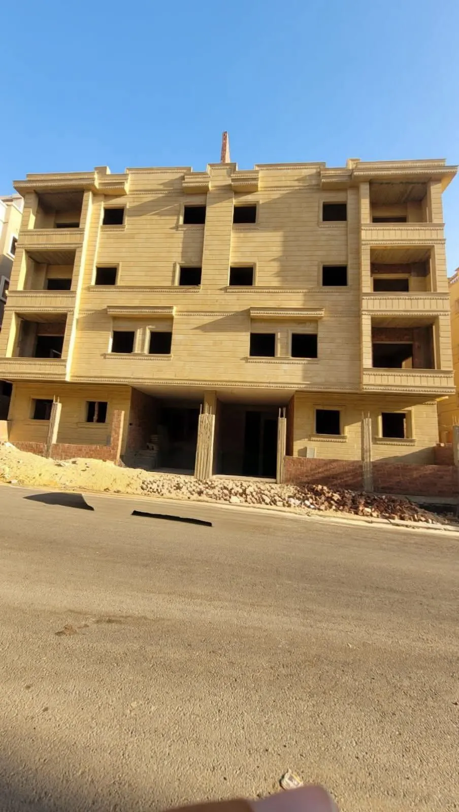 Beige apartment building under construction on a street - apartment in Gardenia Heights 3, New Cairo