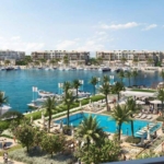 Marina with yachts, pool and waterfront buildings - chalet in Marassi Vida, North Coast