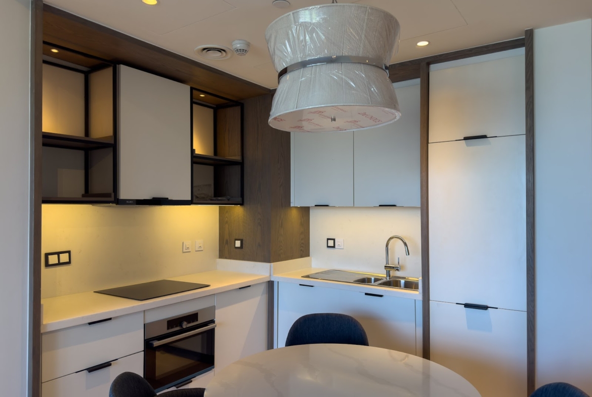 Compact kitchen with pendant lamp and round table - hotel apartment in Marassi The Address Beach, North Coast