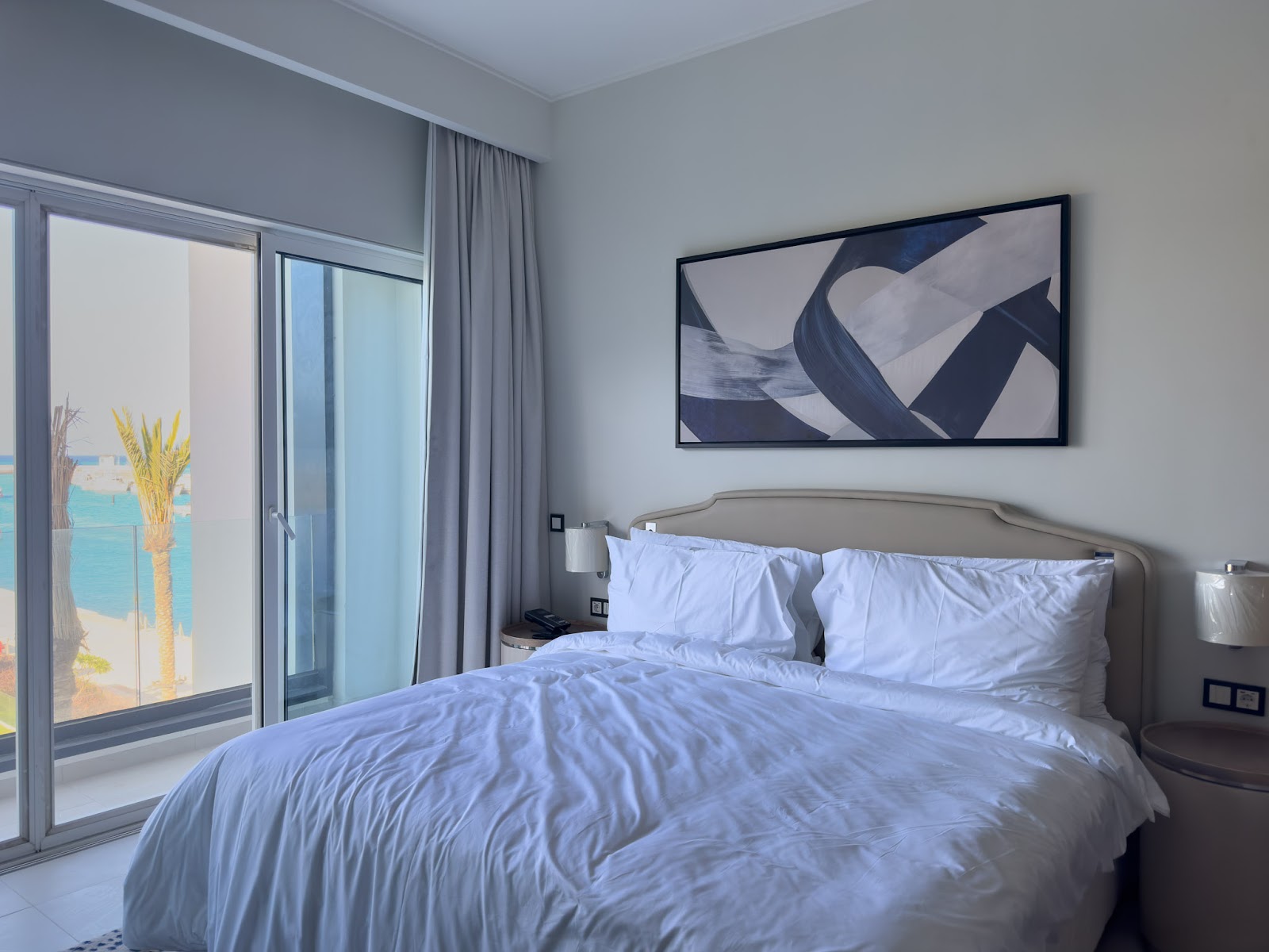 Bedroom with sea view through glass doors - hotel apartment in Marassi The Address Beach, North Coast