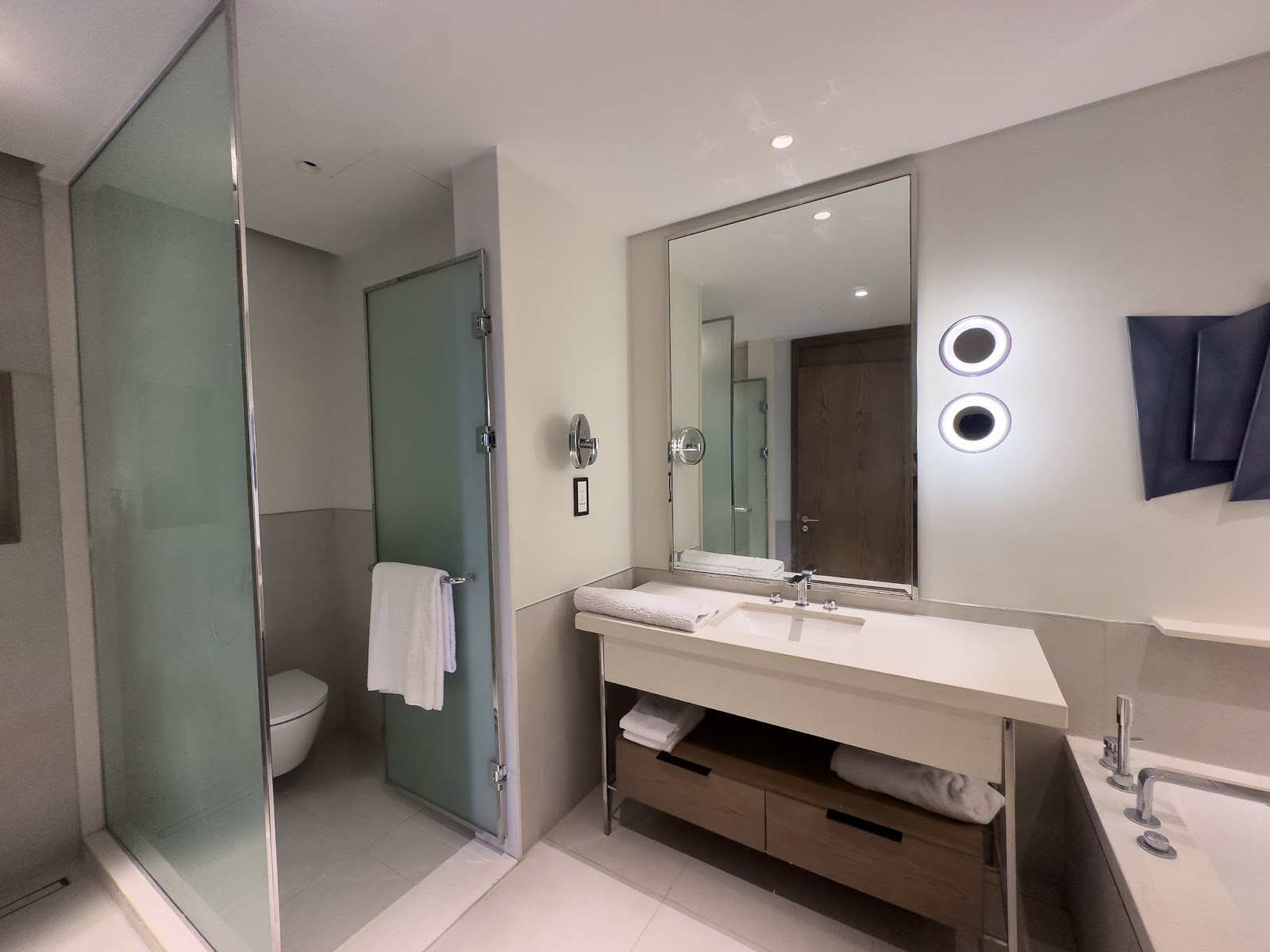 Bathroom with wide vanity, mirror and glass shower - hotel apartment in Marassi The Address Beach, North Coast