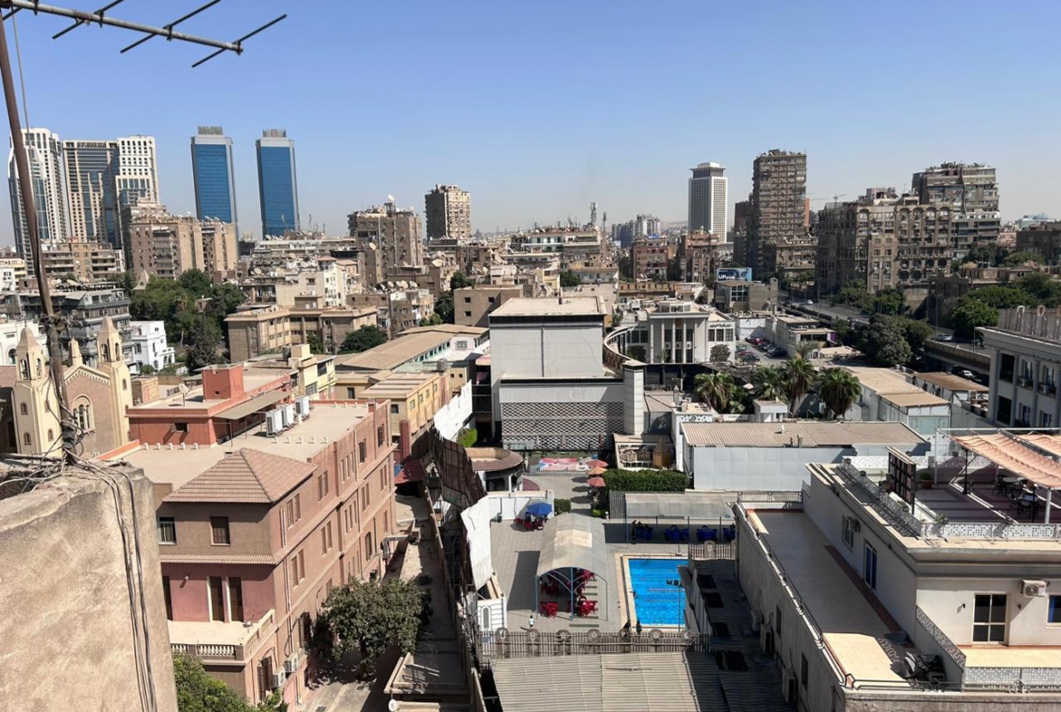 City view over rooftops toward twin towers - shop in Zamalek