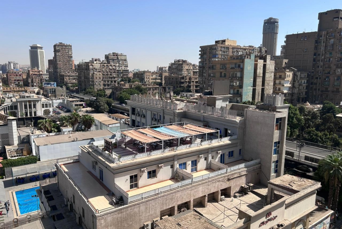 Aerial view of city blocks with rooftop pools - shop in Zamalek