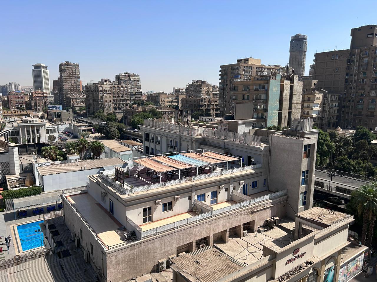 Aerial view of city blocks with rooftop pools - shop in Zamalek