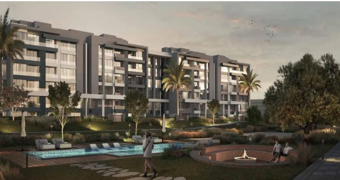 Rendering of apartment blocks around a pool and fire pit at dusk - apartment in Avelin, 5th Settlement