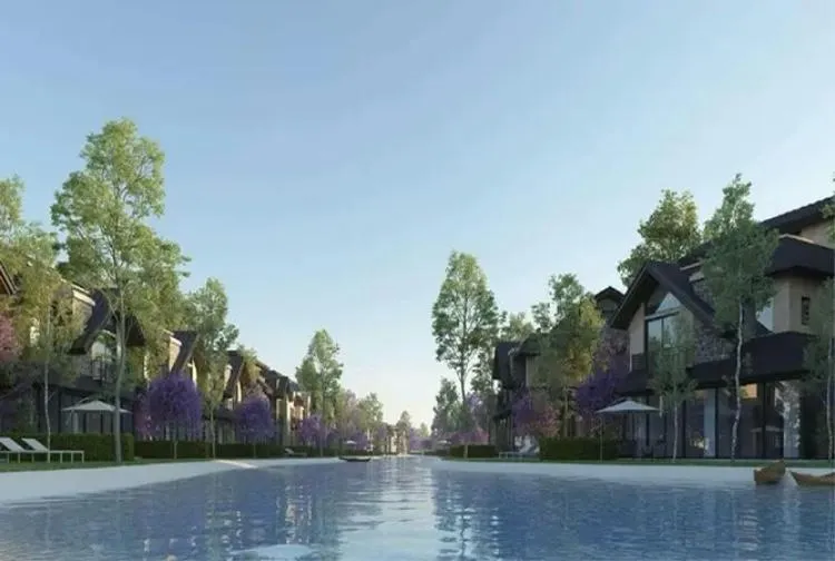 Rendering of a wide lagoon with villas and trees on both banks - townhouse in The Wonder MarQ, Mostaqbal City