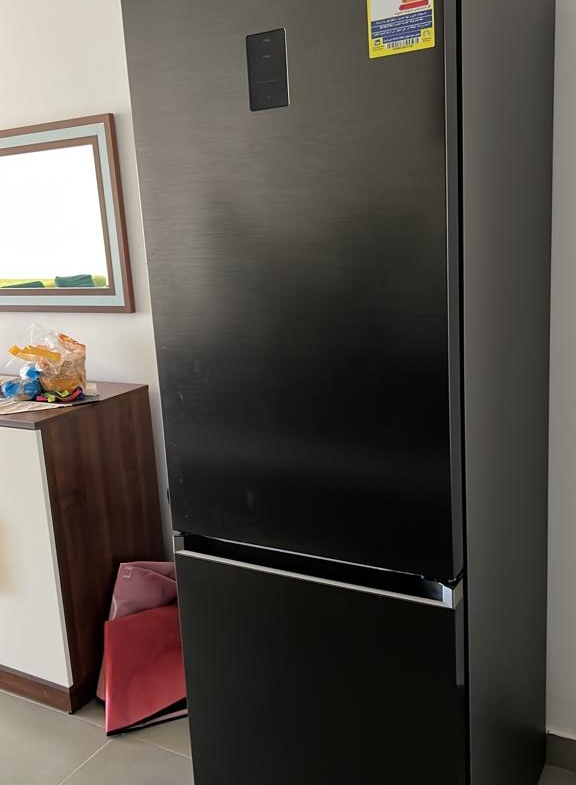 Black fridge freezer in the living area - chalet in Amwaj, North Coast