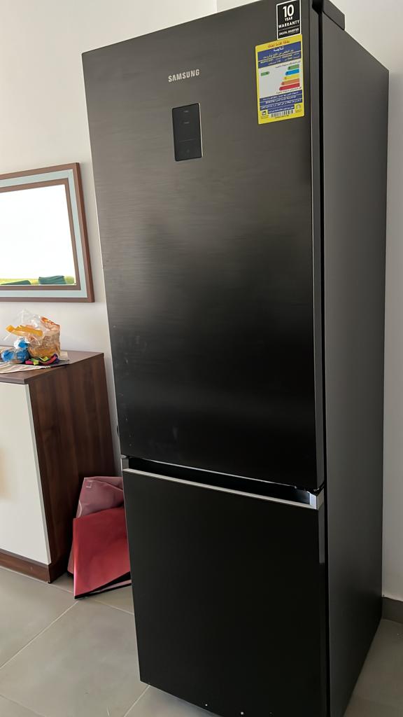 Black fridge freezer in the living area - chalet in Amwaj, North Coast