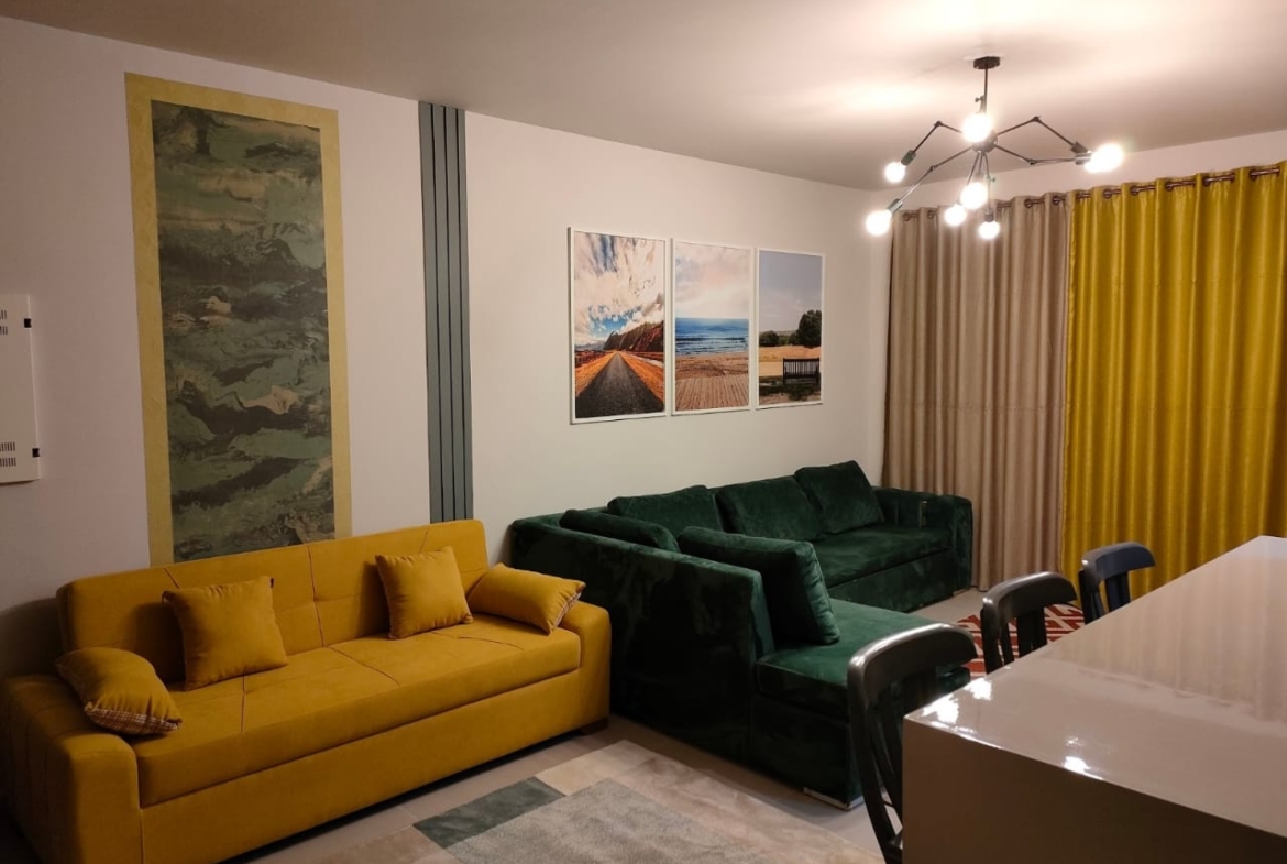 Mustard and green sofas facing the dining table - chalet in Marassi Marina 1, North Coast