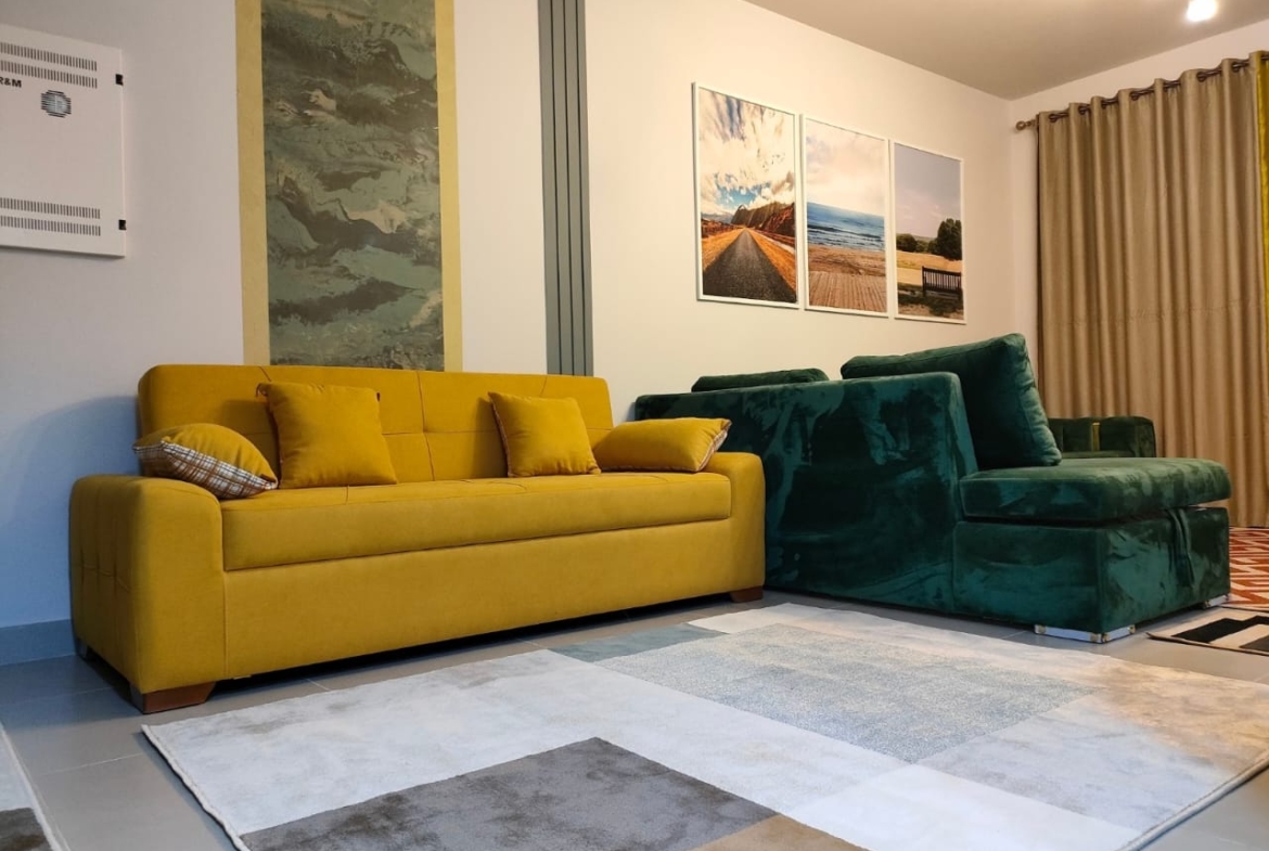 Seating area with grey rug and mustard sofa - chalet in Marassi Marina 1, North Coast