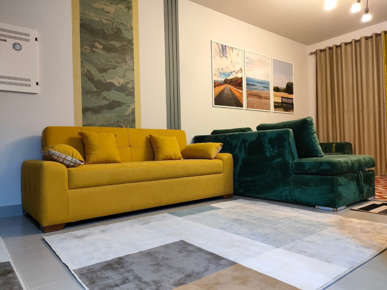 property-image-69f0a8e618a8c Seating area with grey rug and mustard sofa - chalet in Marassi Marina 1, North Coast