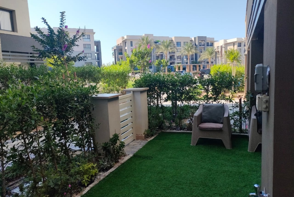 Private garden with artificial lawn and outdoor chair - chalet in Marassi Marina 1, North Coast