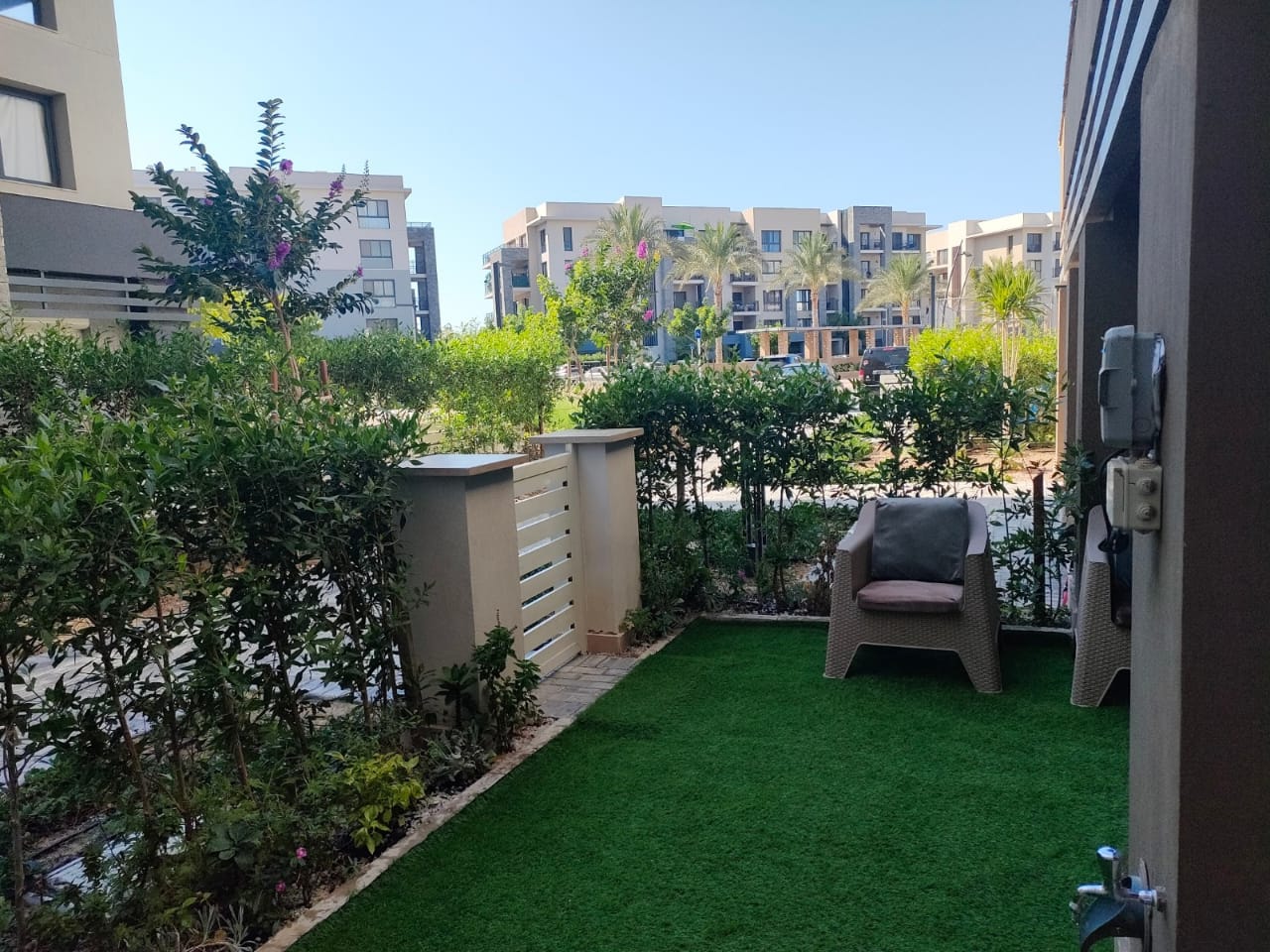 property-image-69f0a8eb61bf5 Private garden with artificial lawn and outdoor chair - chalet in Marassi Marina 1, North Coast