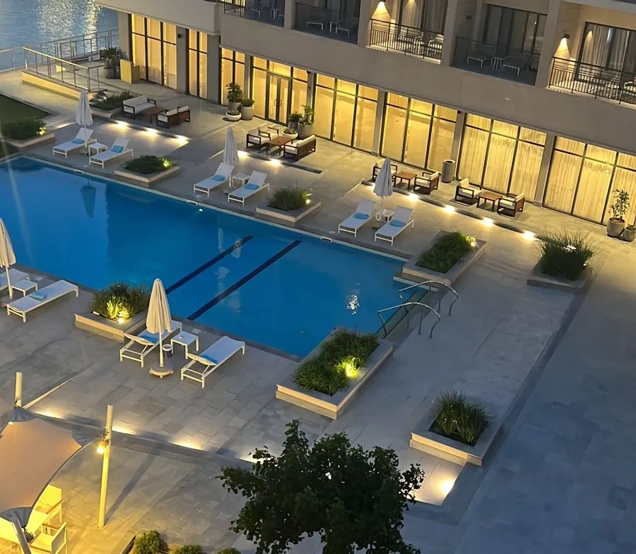 Pool and illuminated building from above at dusk - chalet in Marassi Marina Residence, North Coast