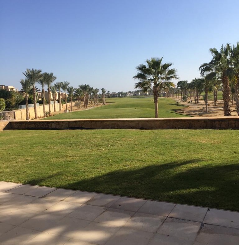 Covered terrace beside a broad green lawn - villa in Little Venice, Ain Sokhna