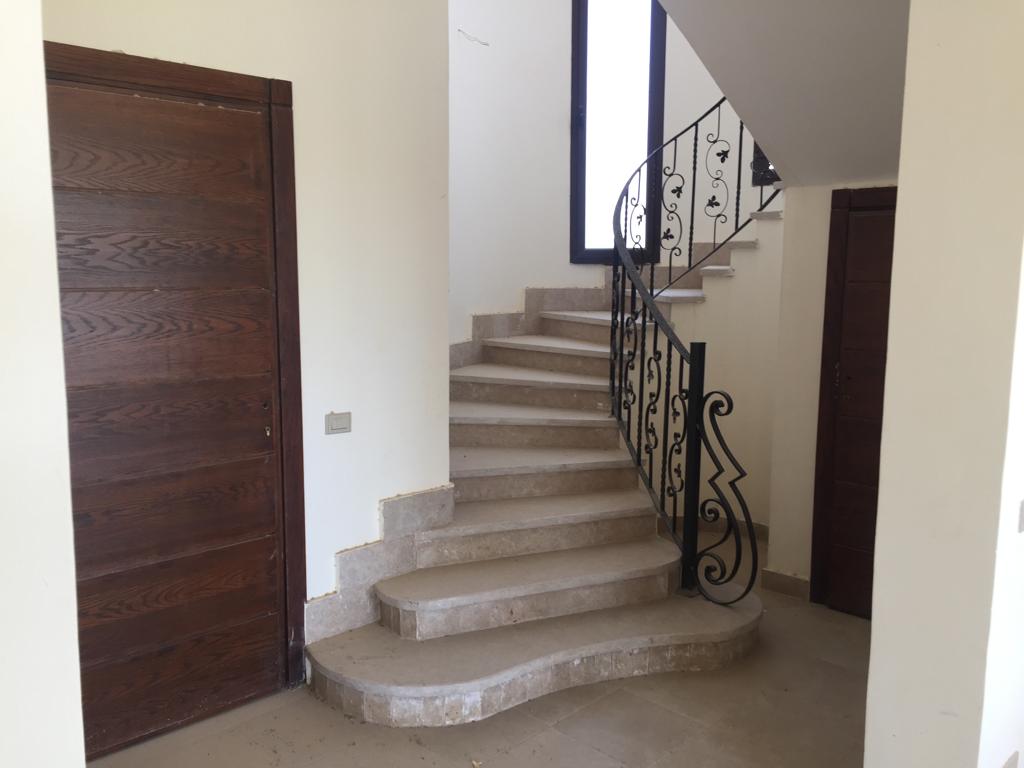 Curved staircase with metal railing - villa in Little Venice, Ain Sokhna