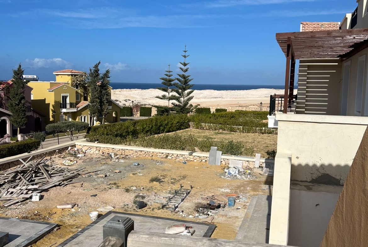 View of the sea past the balcony and building site - villa in Diplomats, North Coast