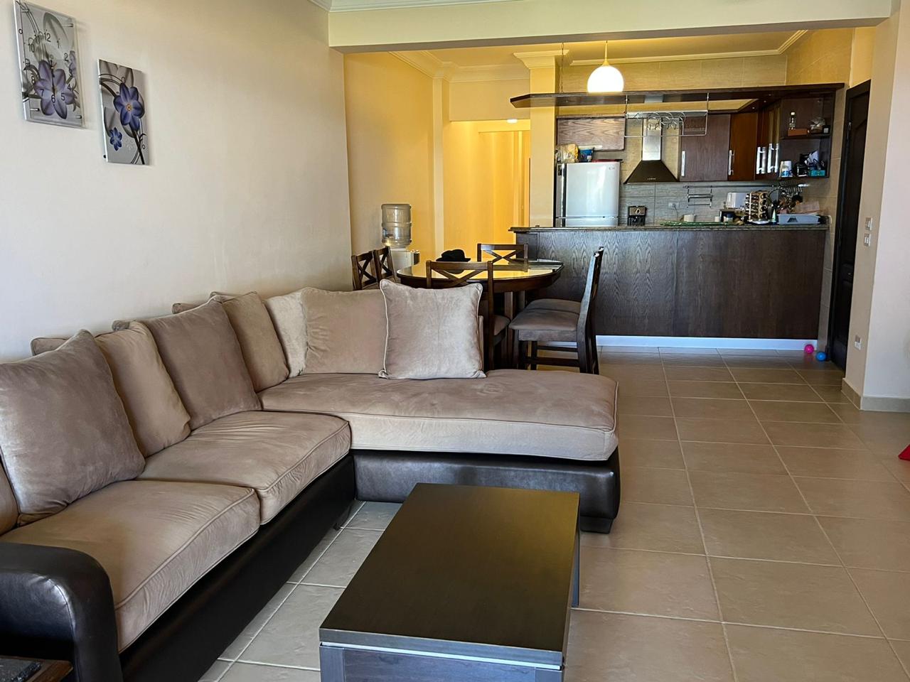 Corner sofa in a living room with an open kitchen behind - chalet in La Vista Bay, North Coast