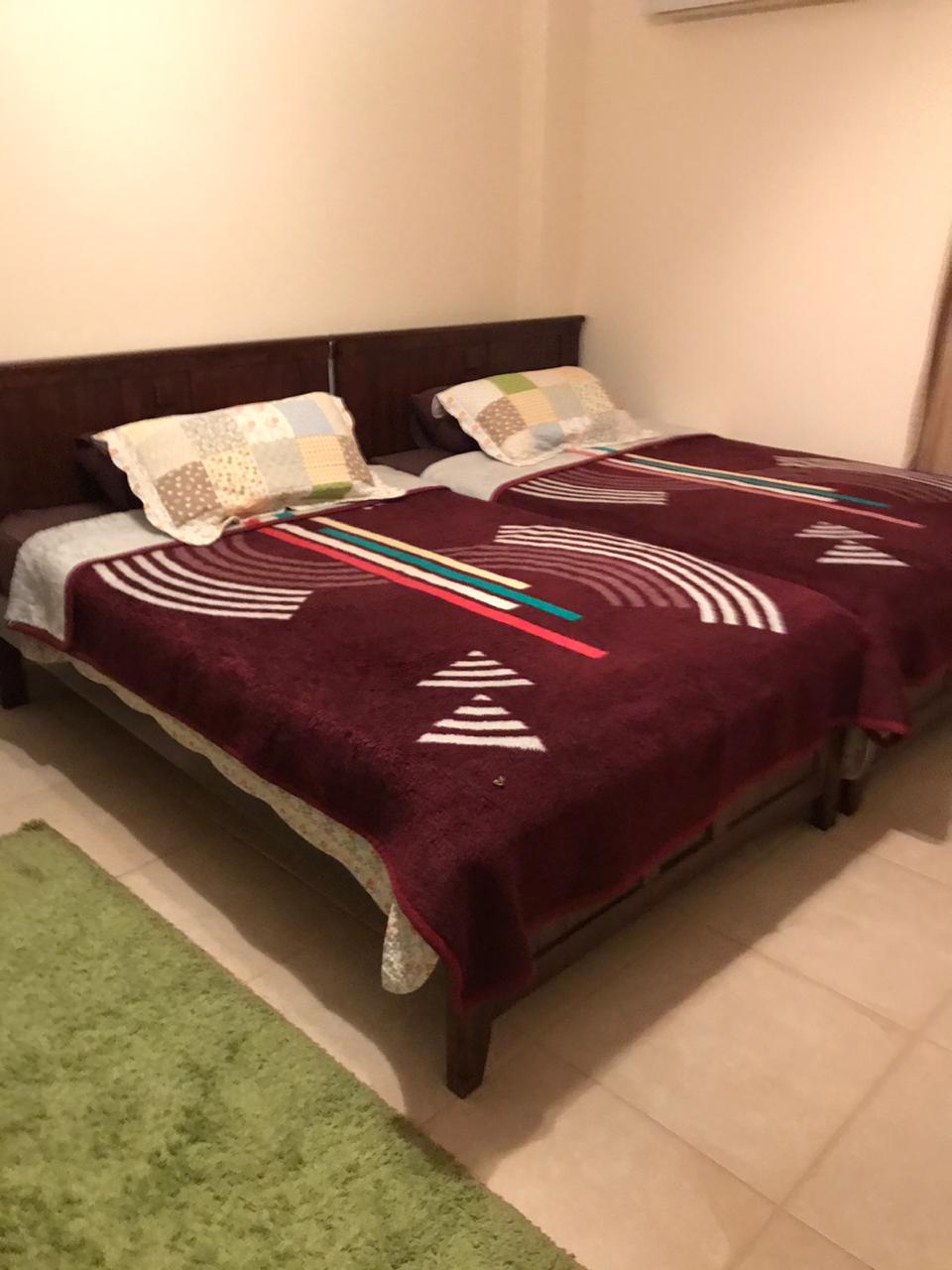 property-image-69f0c50d4cfb2 Double bed with burgundy cover - twinhouse in La Vista 4, Ain Sokhna