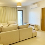 Living room with pale sofa in a Marina 2 chalet, Marassi, North Coast