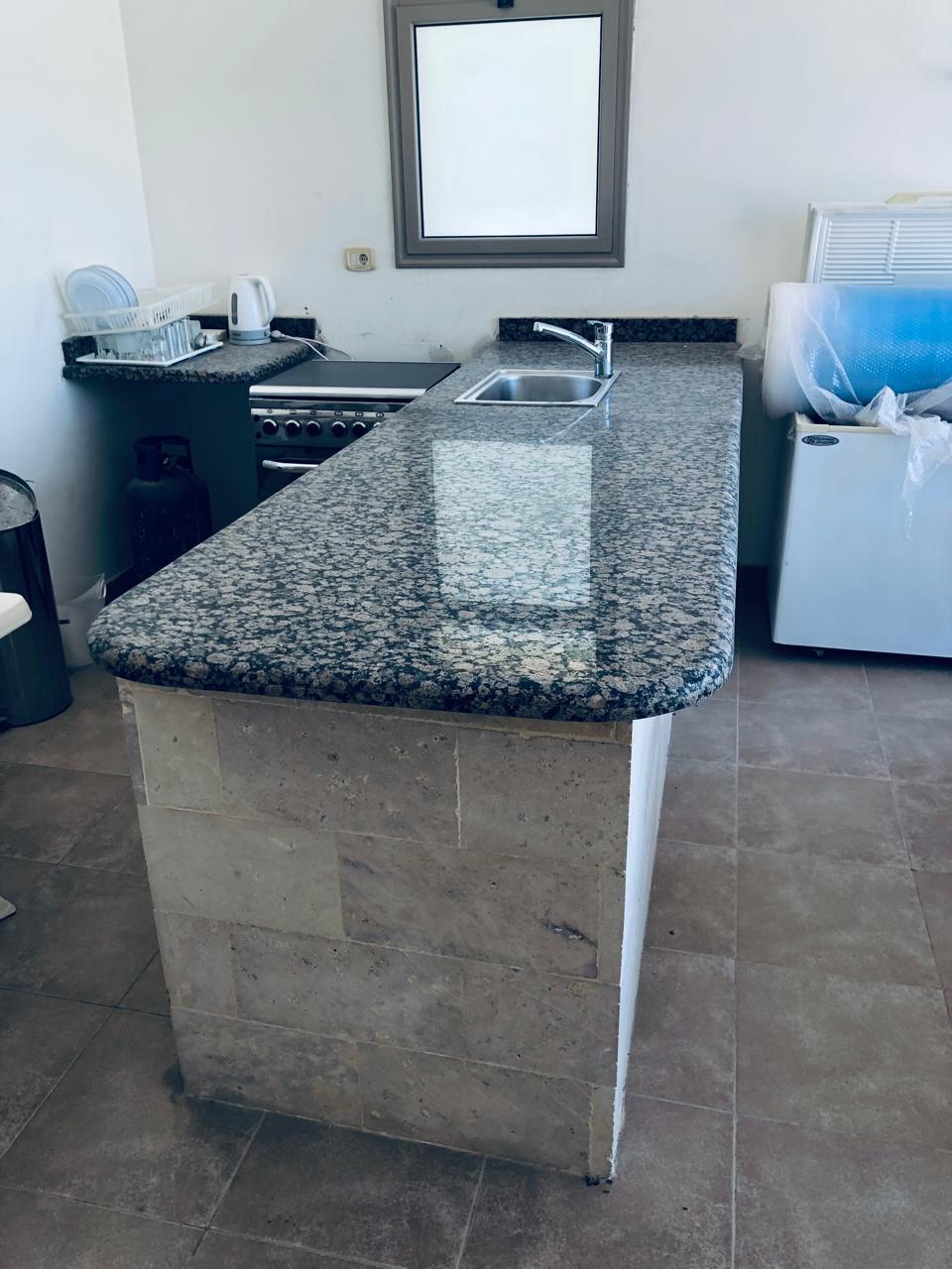 Open kitchen with stone counter - villa in Little Venice, Ain Sokhna