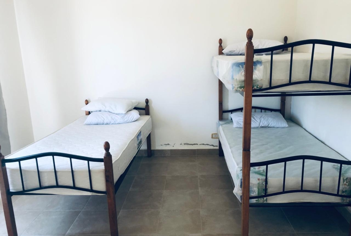 Bedroom with single and bunk beds - villa in Little Venice, Ain Sokhna