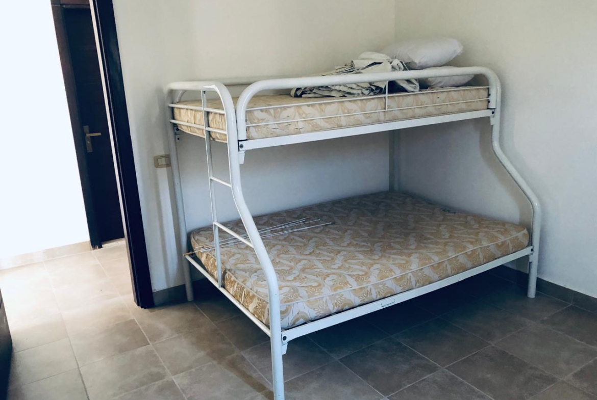Metal bunk bed beside a doorway - villa in Little Venice, Ain Sokhna