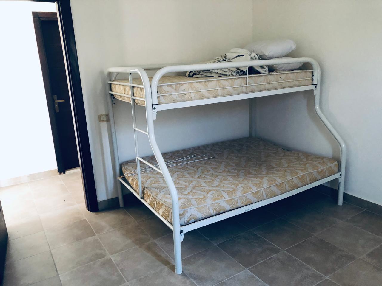 Metal bunk bed beside a doorway - villa in Little Venice, Ain Sokhna