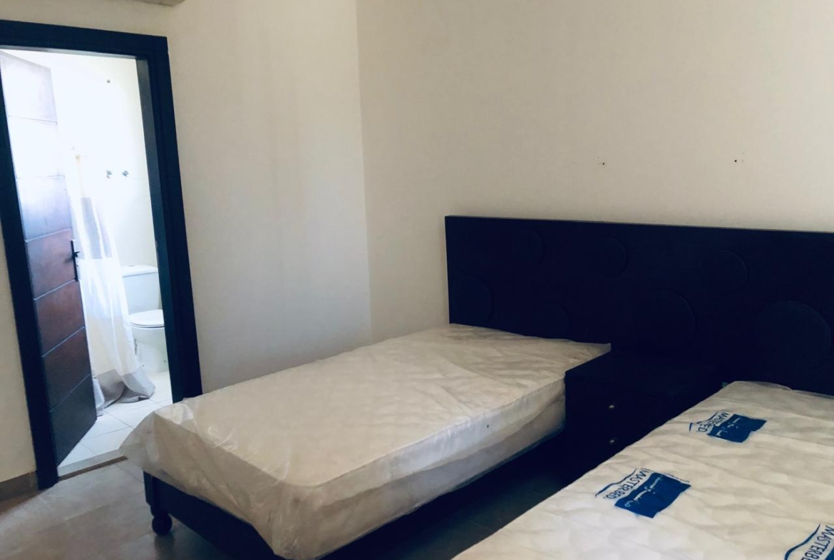 Twin beds beside a bedroom window - villa in Little Venice, Ain Sokhna