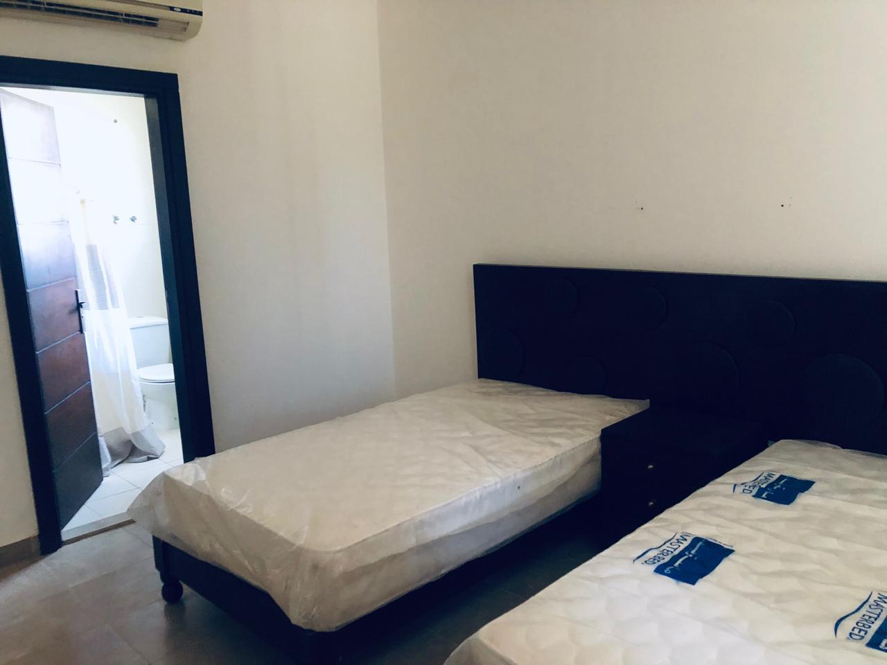 Twin beds beside a bedroom window - villa in Little Venice, Ain Sokhna