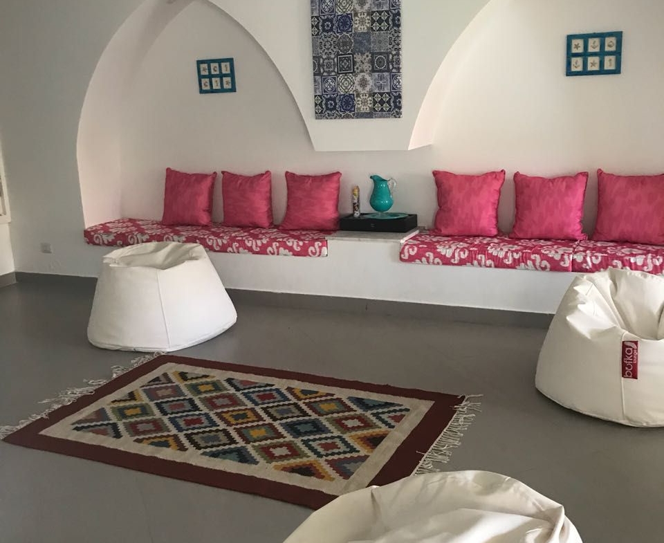 Cosy seating nook with pink cushions and white bean bags - townhouse in Hacienda Bay, North Coast