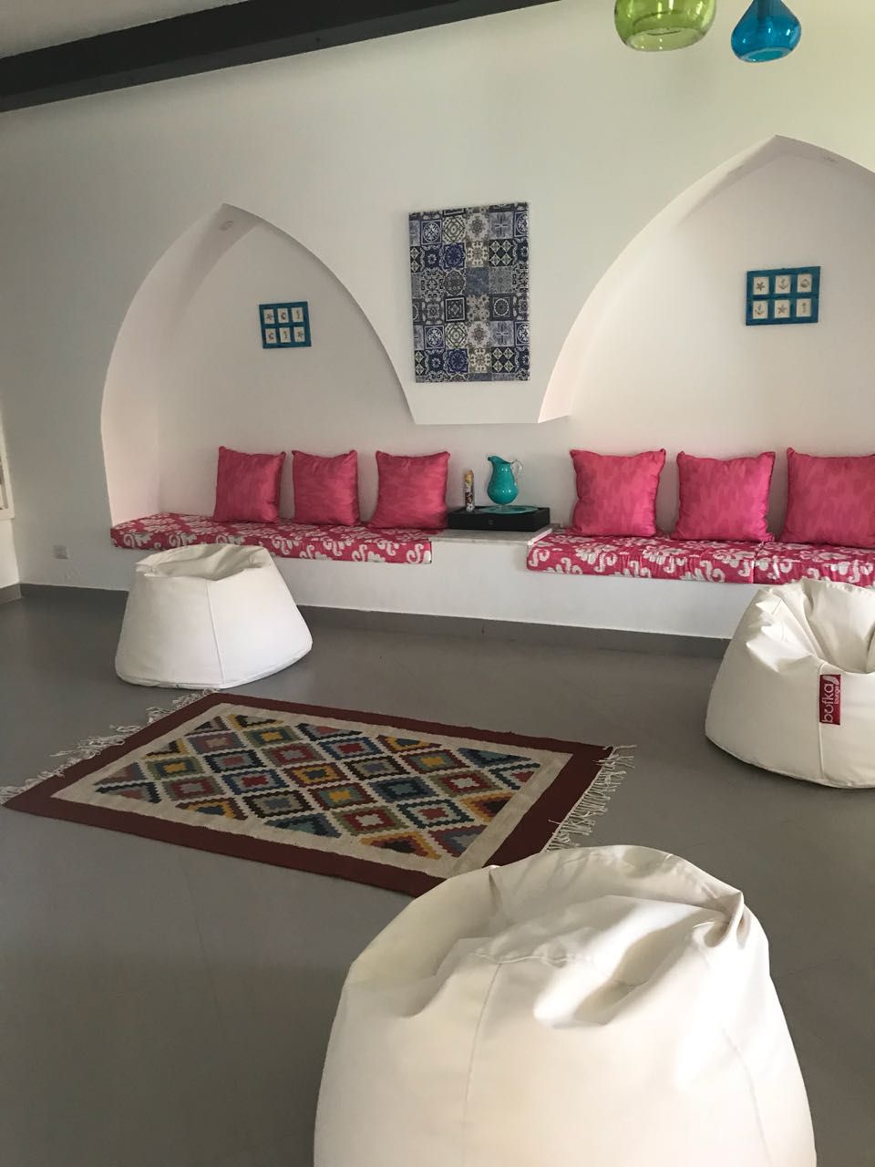Cosy seating nook with pink cushions and white bean bags - townhouse in Hacienda Bay, North Coast