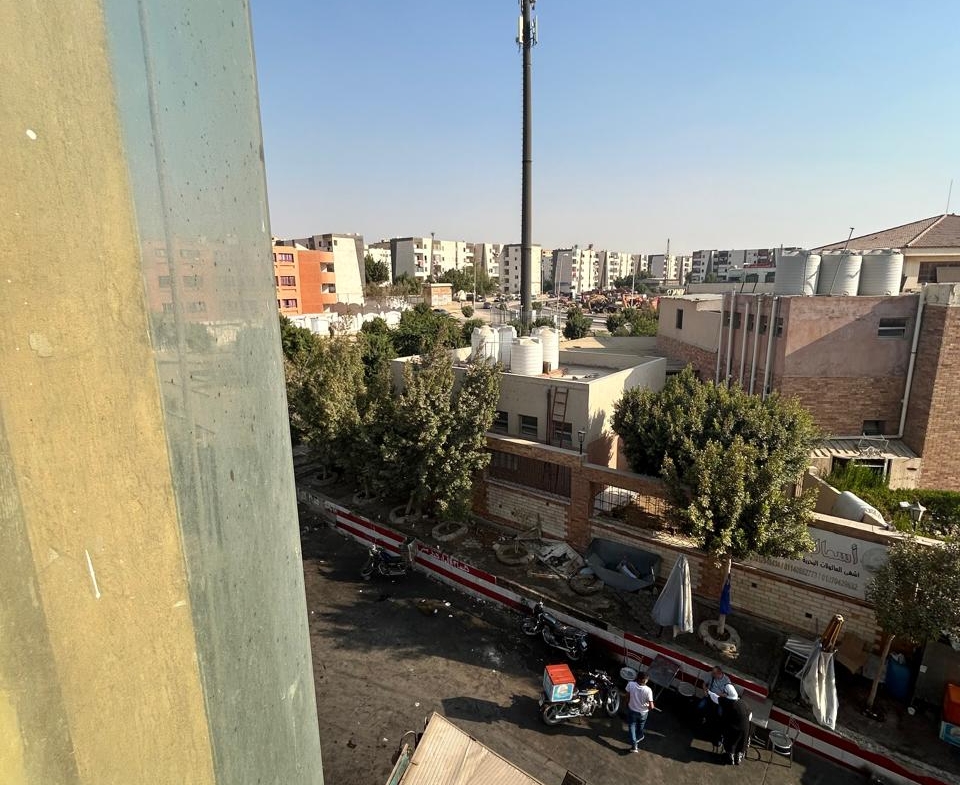 View from a window to a phone mast and low buildings - unit in 5th Settlement, New Cairo