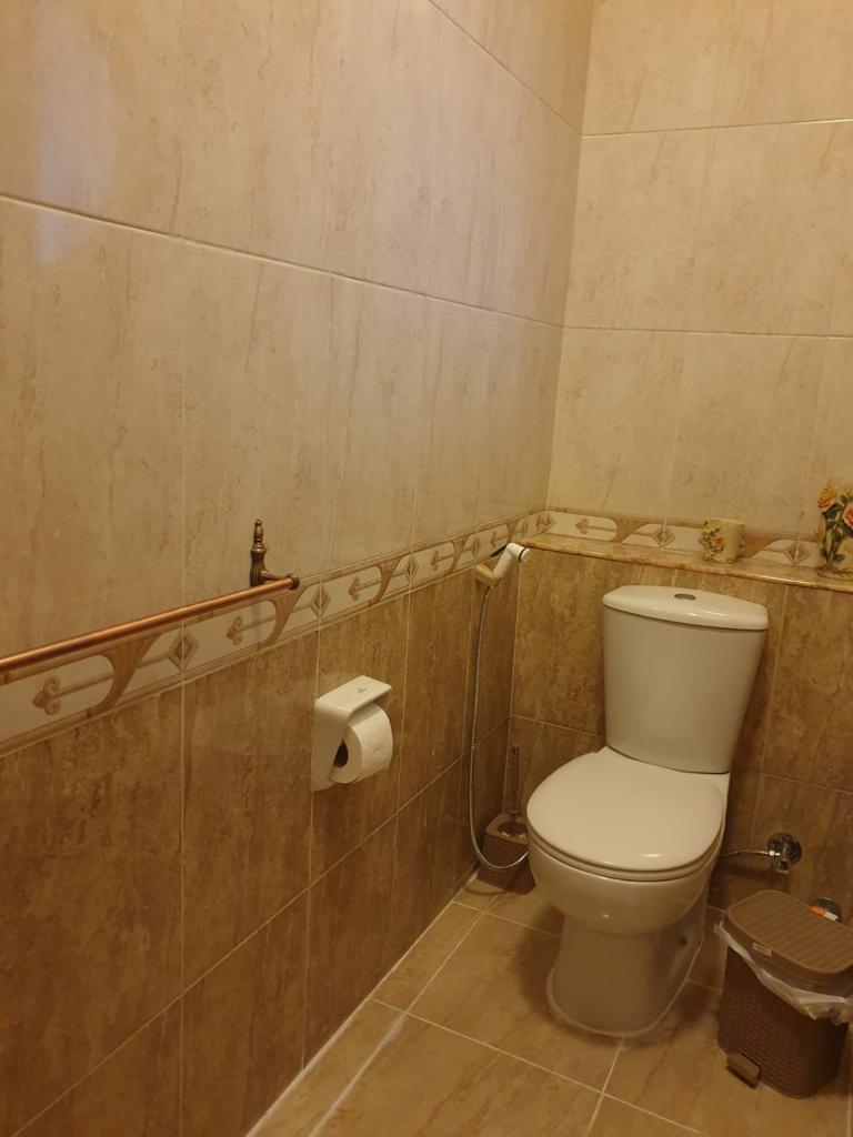 Bathroom with beige and brown tiles - villa in Maadi Heights