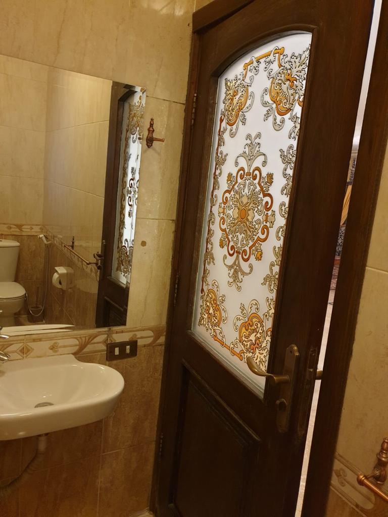 Bathroom with a decorative glass door - villa in Maadi Heights