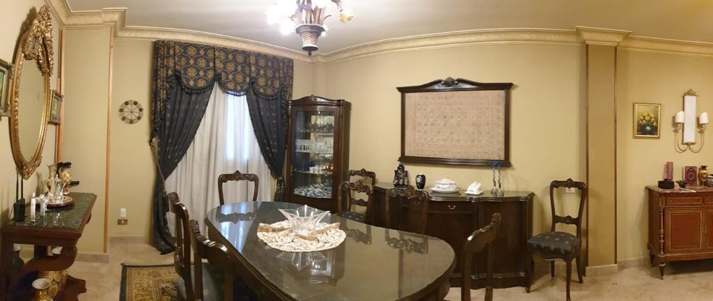 Classic dining room with dark wood furniture - villa in Maadi Heights
