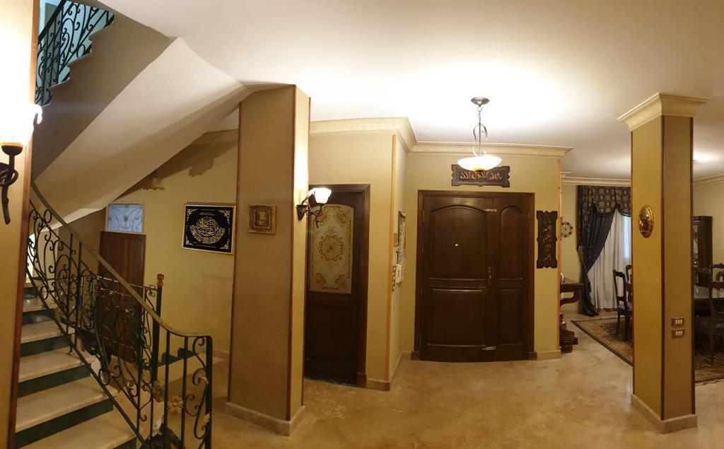 Apartment entrance hall with wooden doors - villa in Maadi Heights