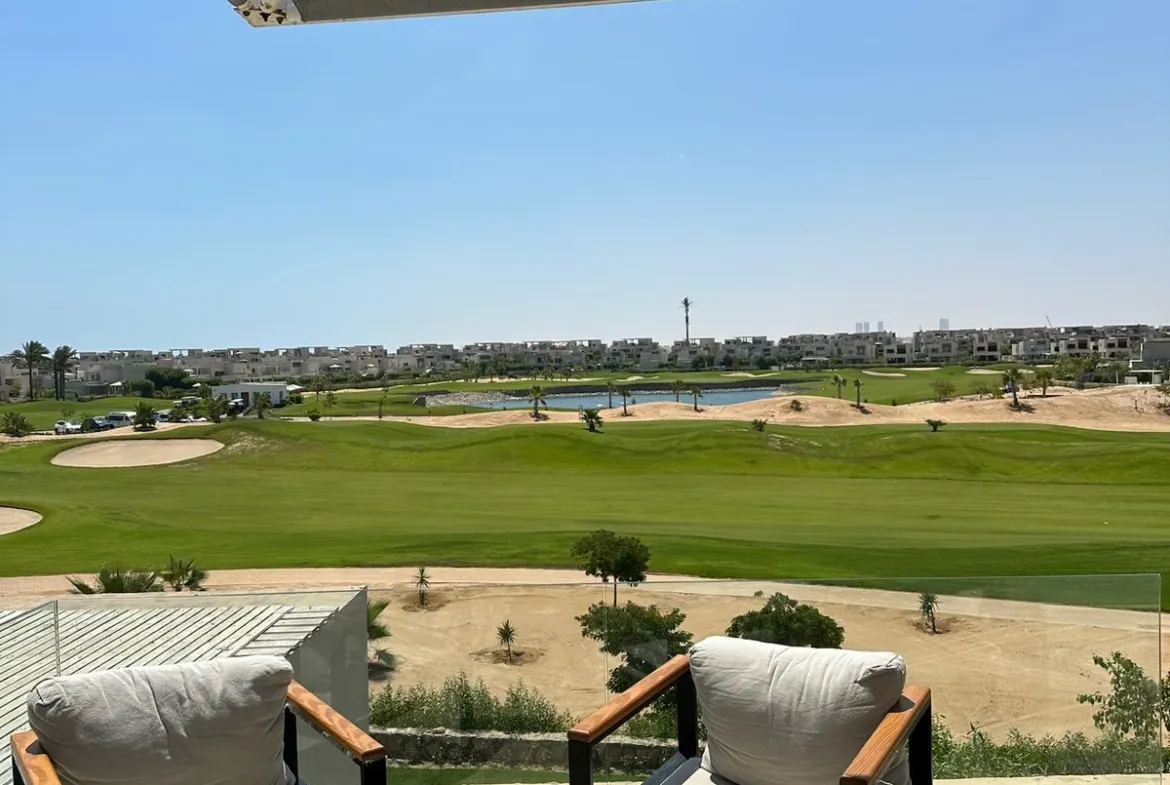 Two armchairs under a canopy facing a golf course - chalet in Hacienda Bay, North Coast