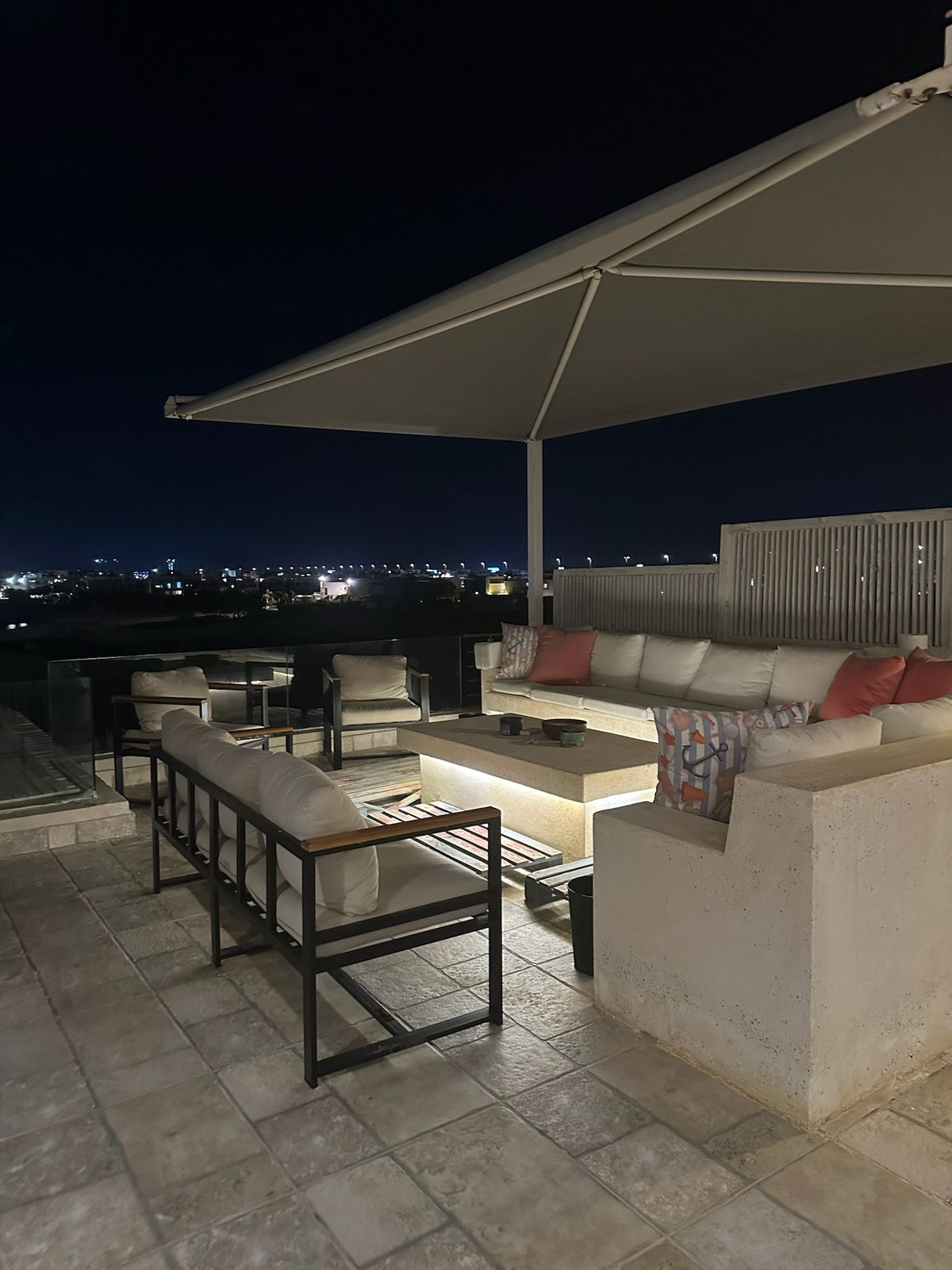 Roof lounge at night with sofas and a low table - chalet in Hacienda Bay, North Coast