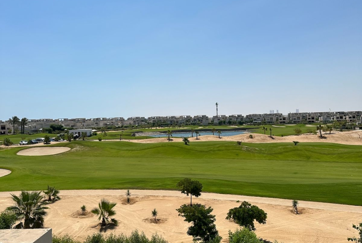 Golf course view over a garden and a sandy bunker - chalet in Hacienda Bay, North Coast