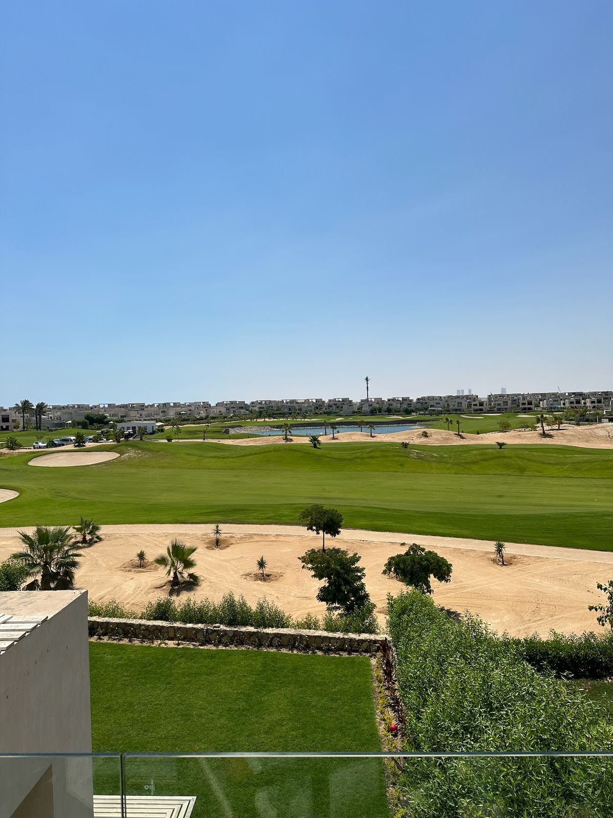 Golf course view over a garden and a sandy bunker - chalet in Hacienda Bay, North Coast