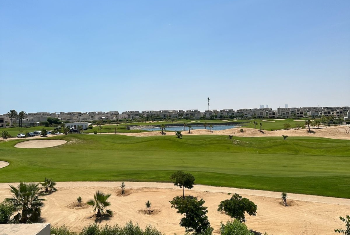Green fairway and landscaped garden seen from the balcony - chalet in Hacienda Bay, North Coast