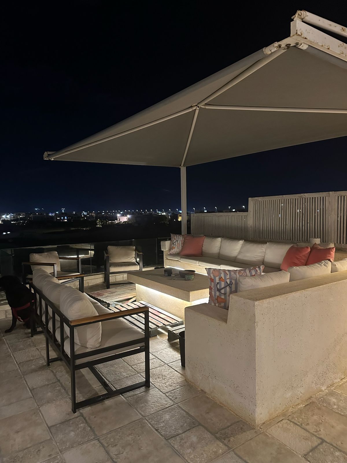 Covered roof seating area lit up at night - chalet in Hacienda Bay, North Coast