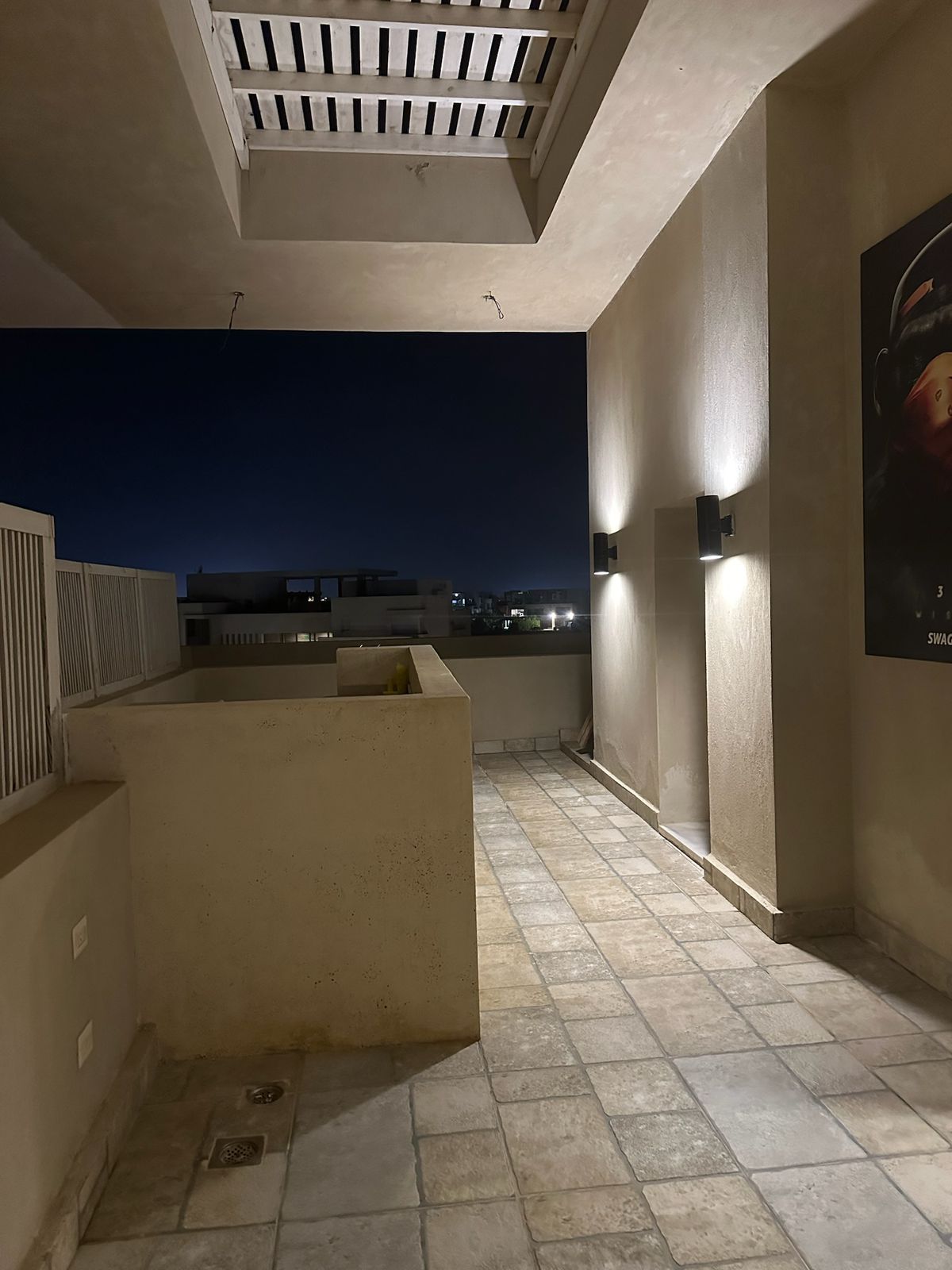 Terrace corner with wall lights and stone floor - chalet in Hacienda Bay, North Coast