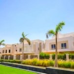 Garden view of a standalone villa for sale in Atrio, Sheikh Zayed