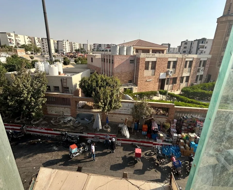 View down to the street from a glass balcony - unit in 5th Settlement, New Cairo