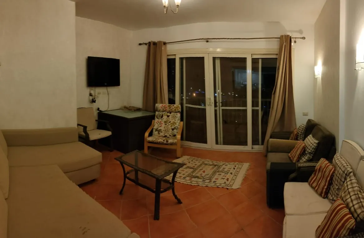 Living room with sofas and balcony doors - chalet in Porto Al Sokhna, Ain Sokhna
